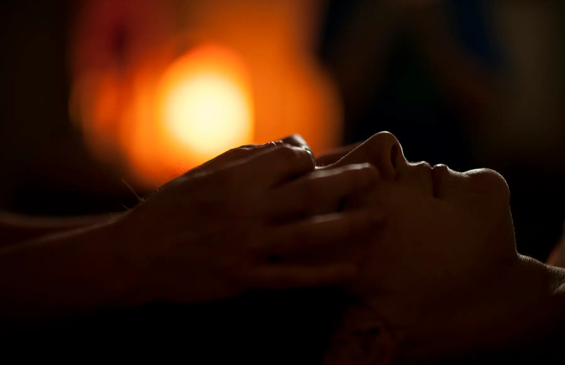 A face massage by candlelight